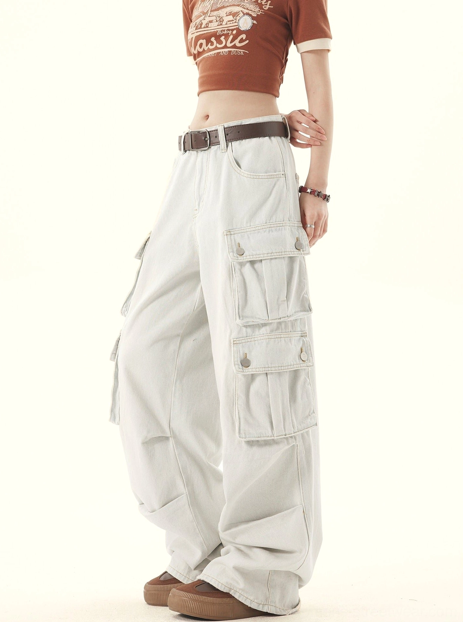 Rear three quarter view of women’s washed denim wide leg cargo pants with back pockets and relaxed silhouette