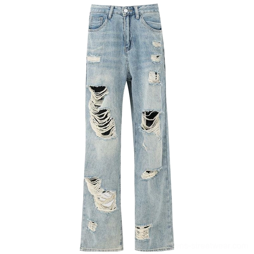 Light wash distressed high-waist wide-leg grunge jeans blue color variant with ripped legs and vintage faded finish