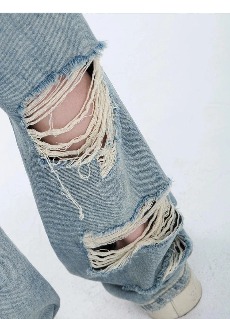 Light wash distressed high-waist wide-leg grunge jeans faded blue denim product detail for Y2K and grunge outfits