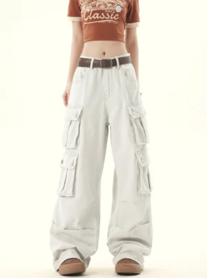Front full body view of women wearing light wash gray wide leg denim cargo pants with thigh flap pockets