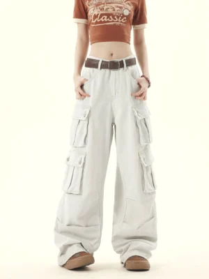 Front view of light gray washed denim wide leg cargo pants showing waistband belt loops and utility pockets