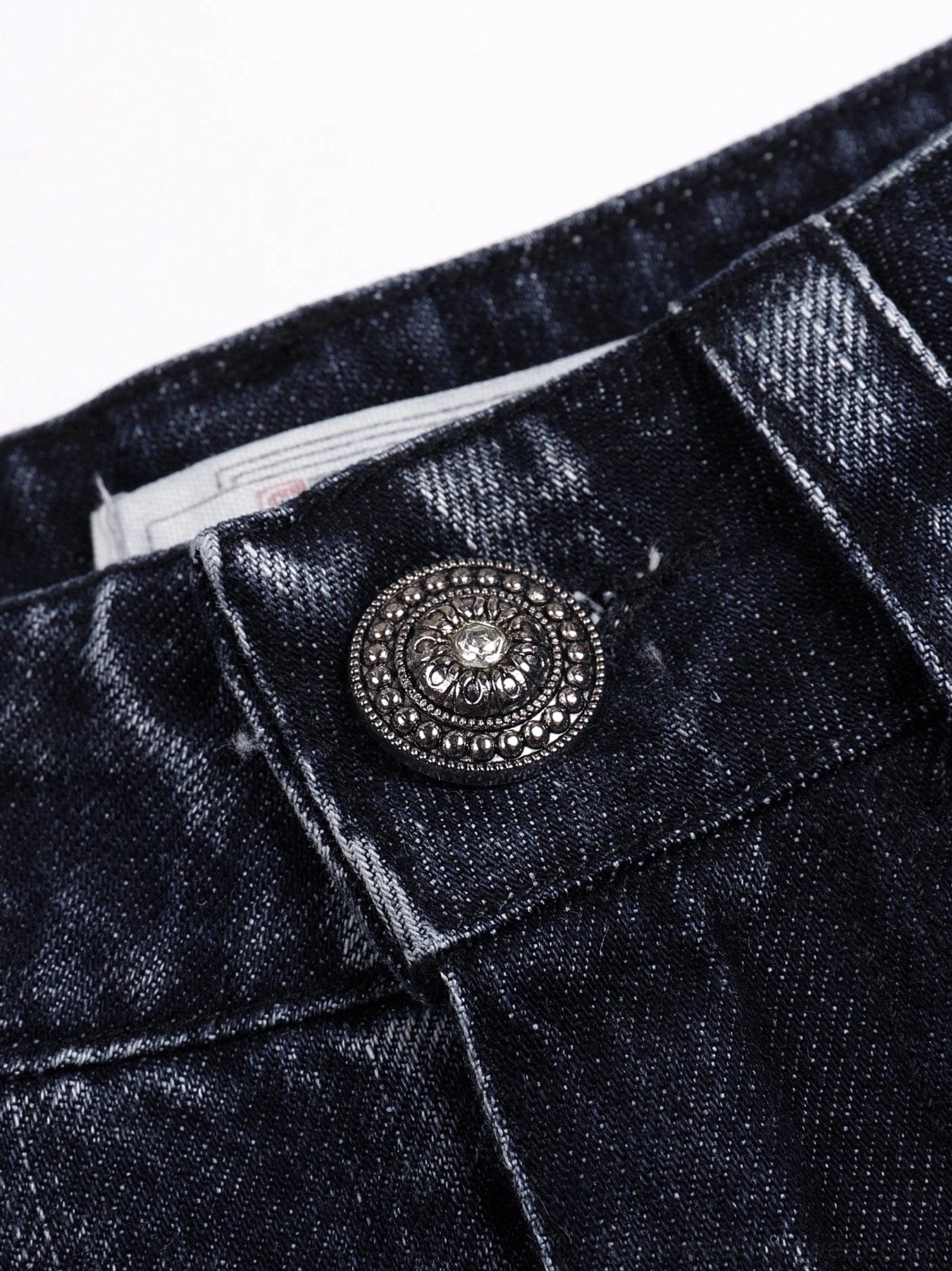 Close-up product view of lightning wash wide-leg Y2K streetwear jeans in dark indigo denim