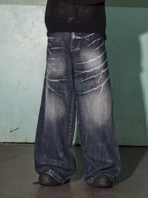 Front full-body view of dark indigo lightning wash wide-leg jeans with an oversized Y2K streetwear silhouette