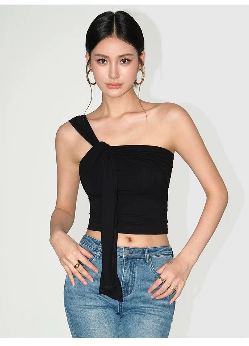 Elegant asymmetric crop top in lightweight stretch knit designed for elevated everyday and evening outfits