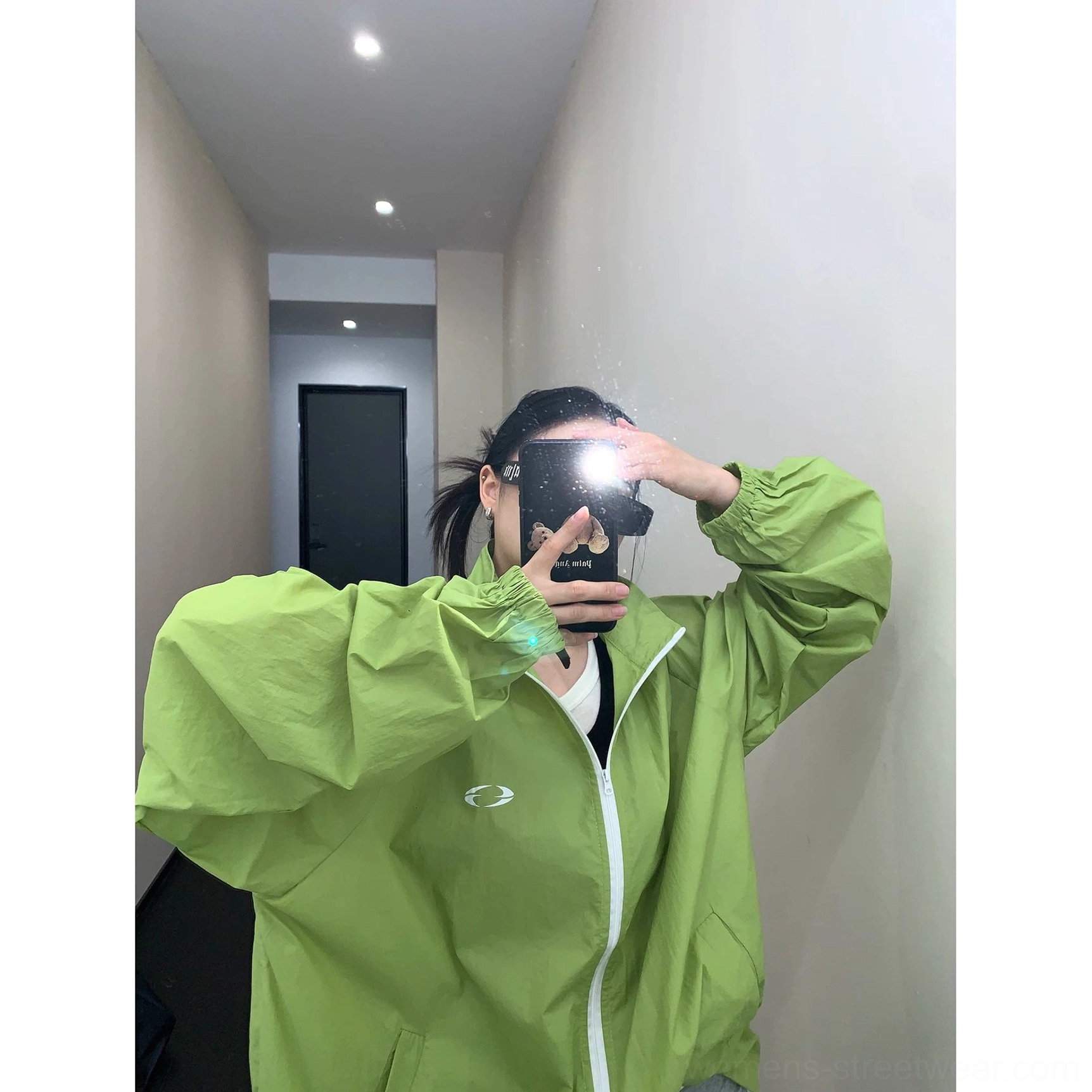Lightweight oversized windbreaker jacket product detail with breathable woven polyester fabric, relaxed boxy fit, elastic cuffs, and sun-protection design