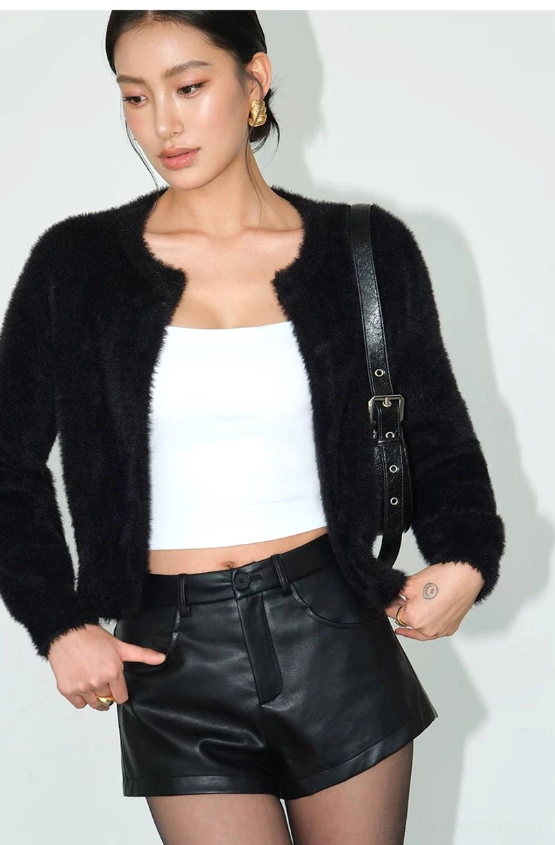 Lightweight plush cardigan with clean crew neckline and versatile button-front design for casual urban outfits