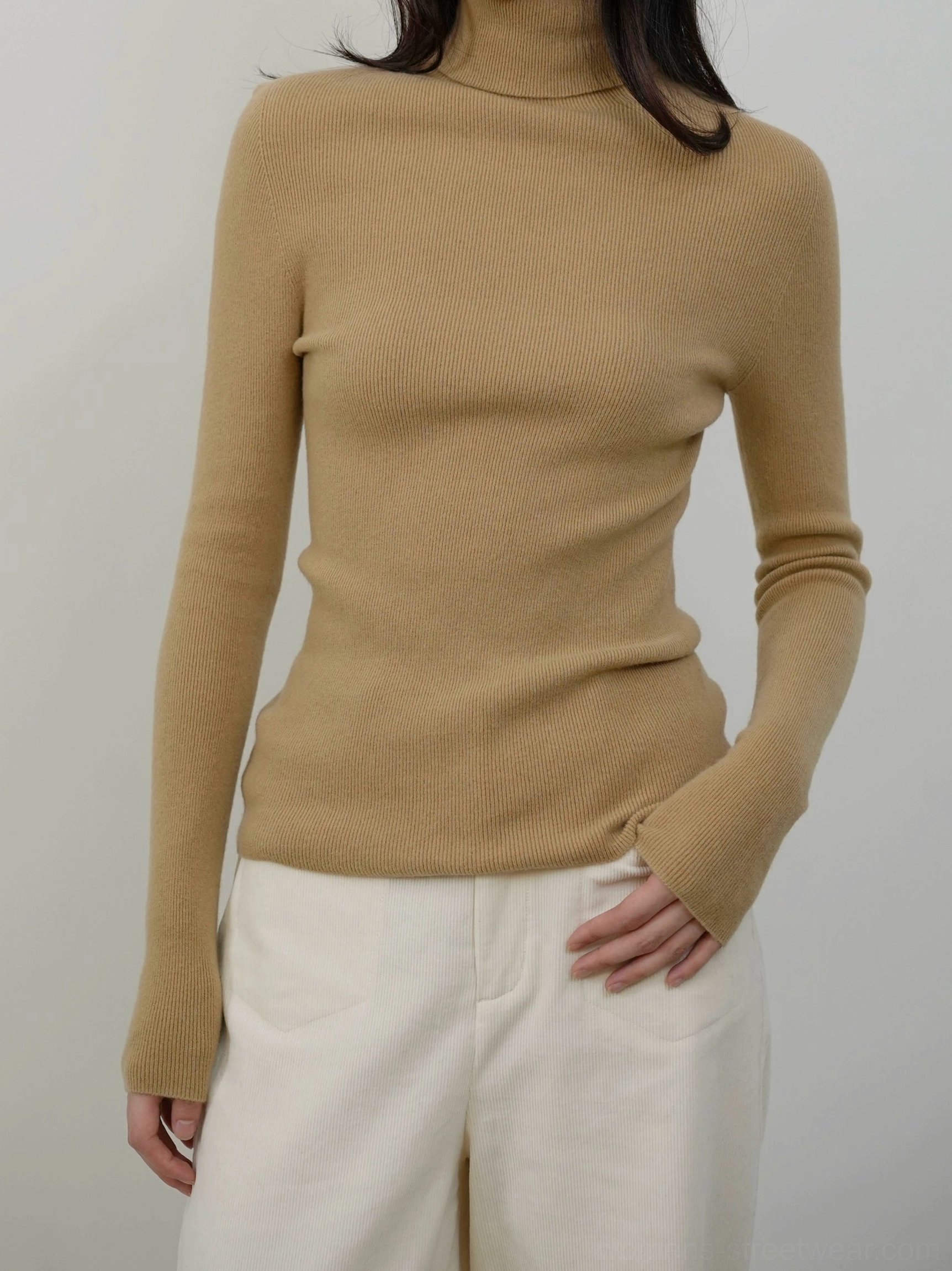 Lightweight women's mock neck knit sweater with stretch fabric and long sleeves for minimalist layered outfits