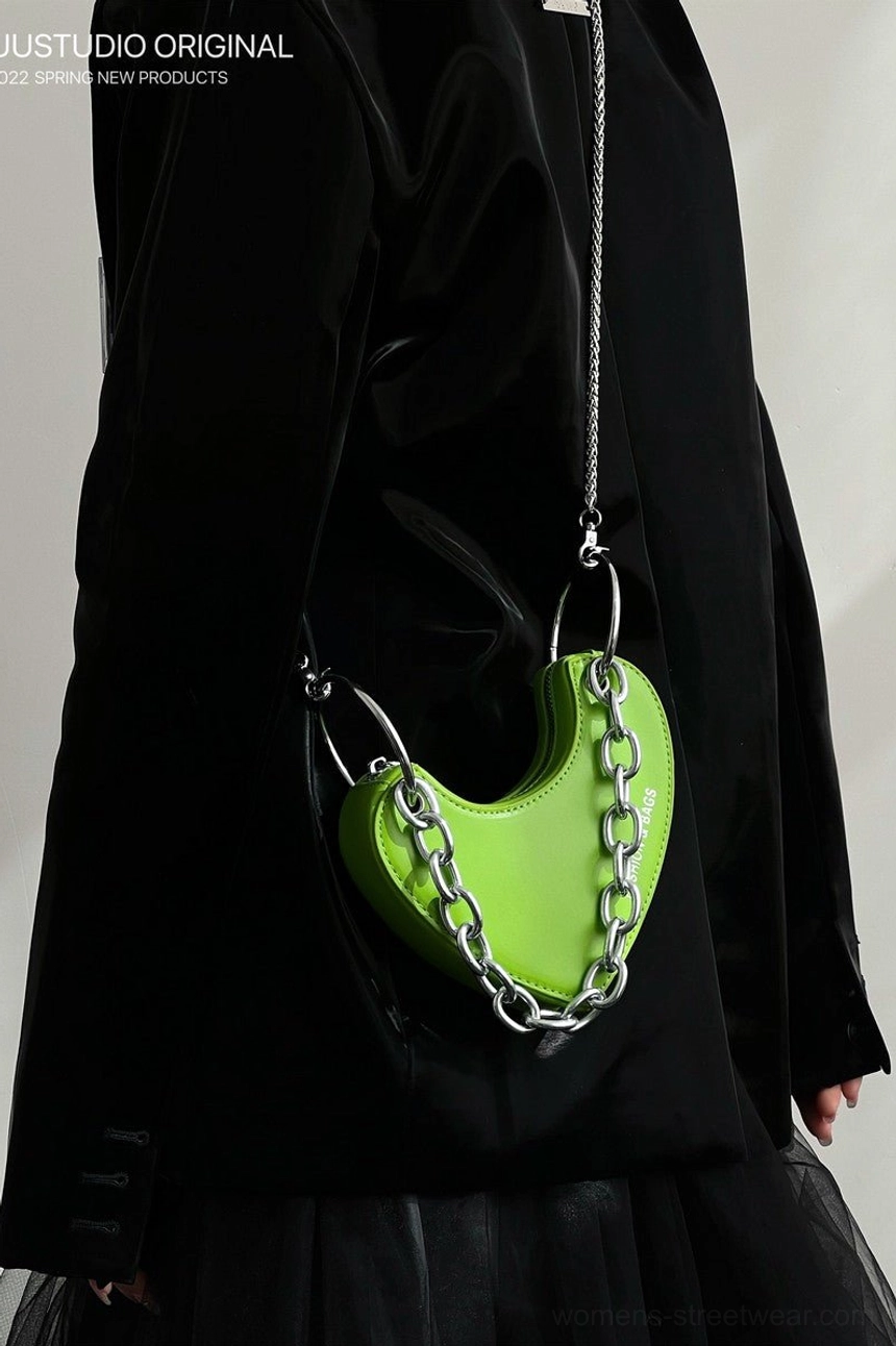 Back view of lime green heart-shaped crossbody mini bag with silver chain strap