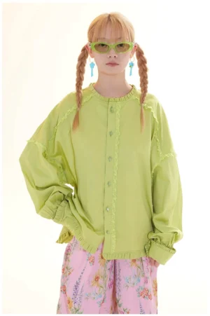 Front view of a lime green lace trim button-down blouse with ruffled stand collar, curved hem, matching buttons, and relaxed streetwear styling