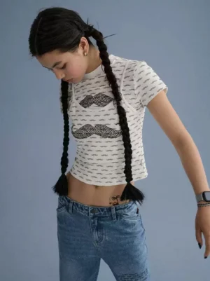 Lip print cropped graphic tee layered over a camisole in an Acubi-inspired Korean streetwear outfit