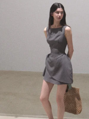 London fog grey sculpted draped mini dress with wide neckline, fitted waist and asymmetric draped skirt front view