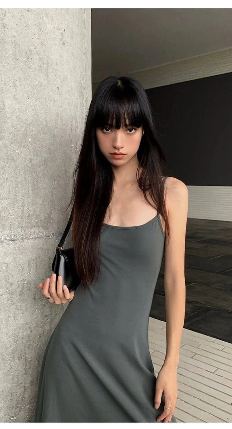 Long spaghetti strap slip dress with a sleek square neckline and relaxed streetwear inspired maxi fit