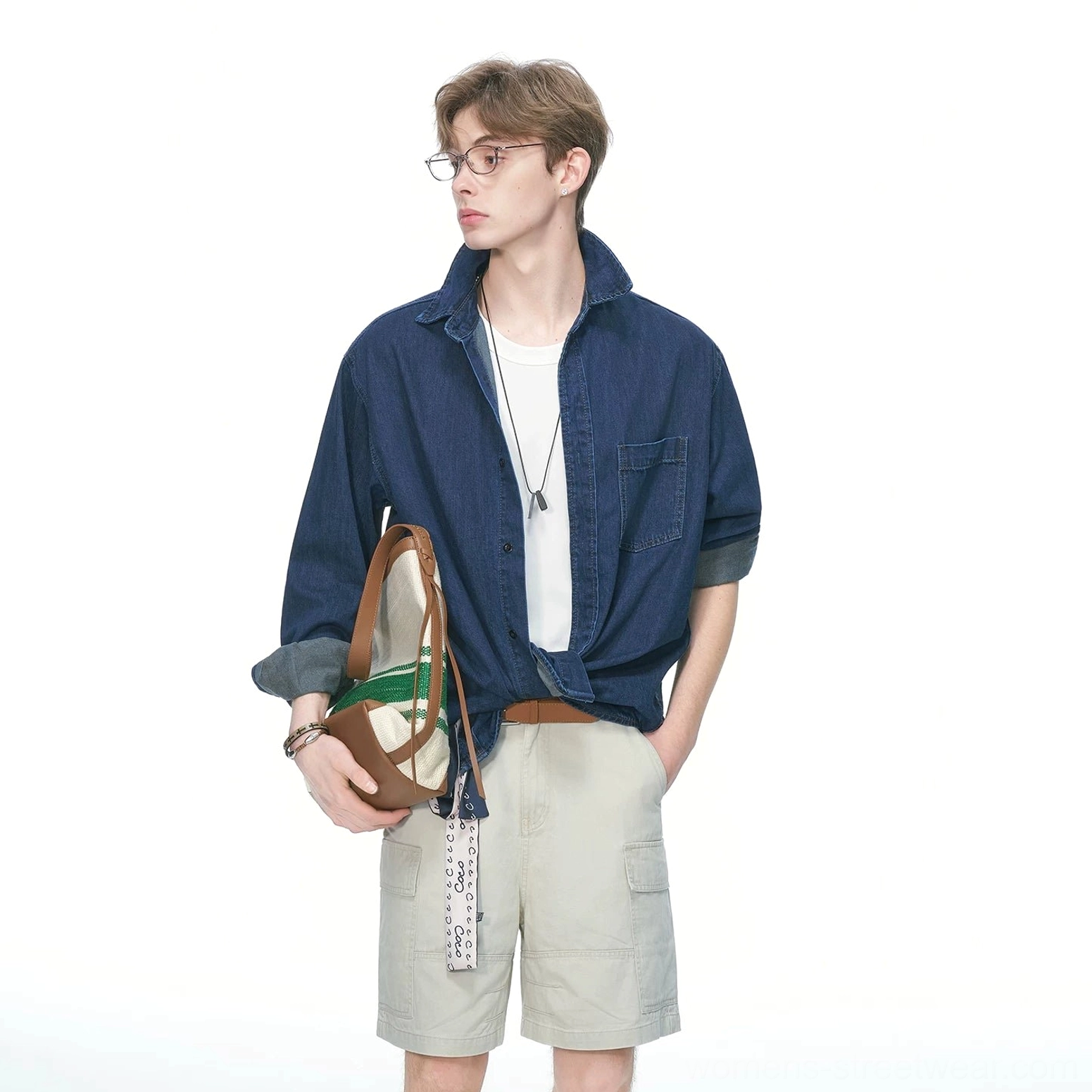 Loose boxy denim shirt with oversized chest pocket, curved hem, and relaxed proportions inspired by Seoul casualwear