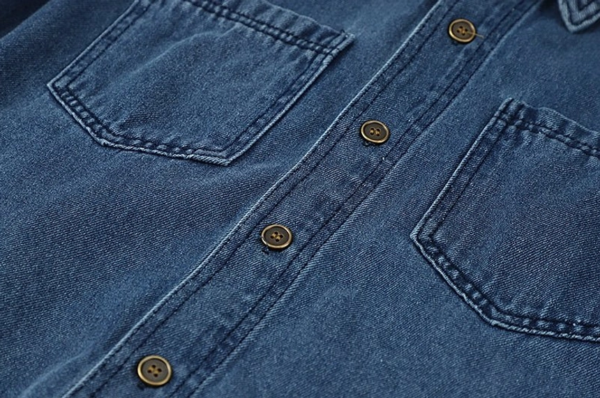 Loose fit washed blue denim jacket shirt for women with a clean minimalist design and easy streetwear styling