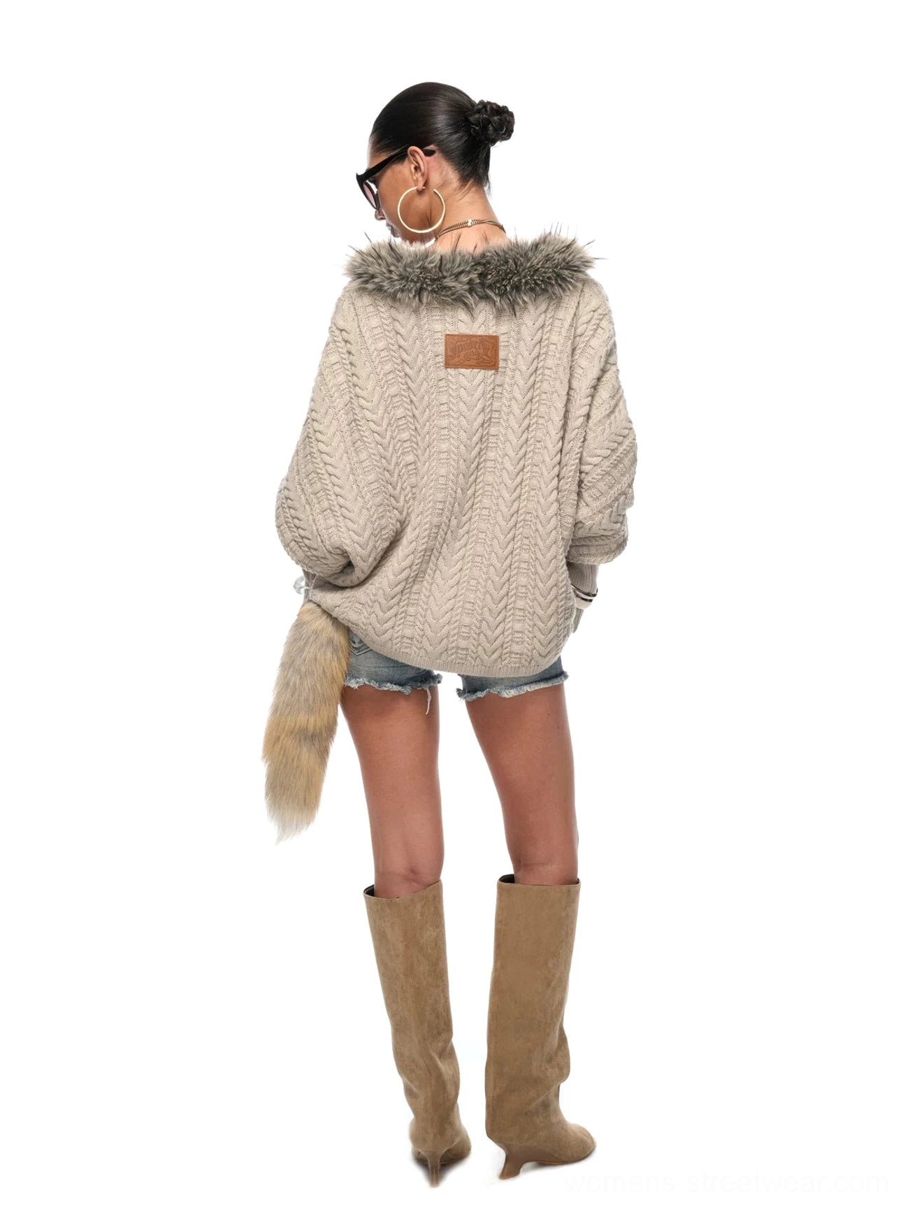 Full back view of a loose silver gray cable knit sweater with faux fur tail accent and relaxed oversized fit