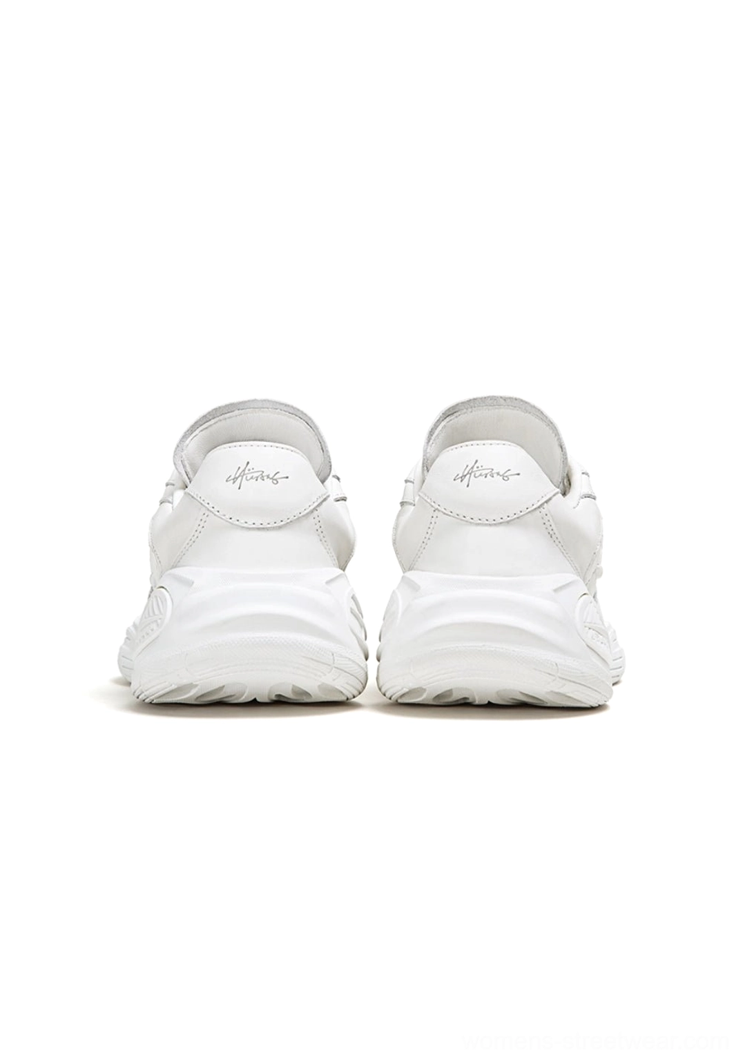 Low-profile quilted sport sneakers with curved contrast overlays and lace-up construction
