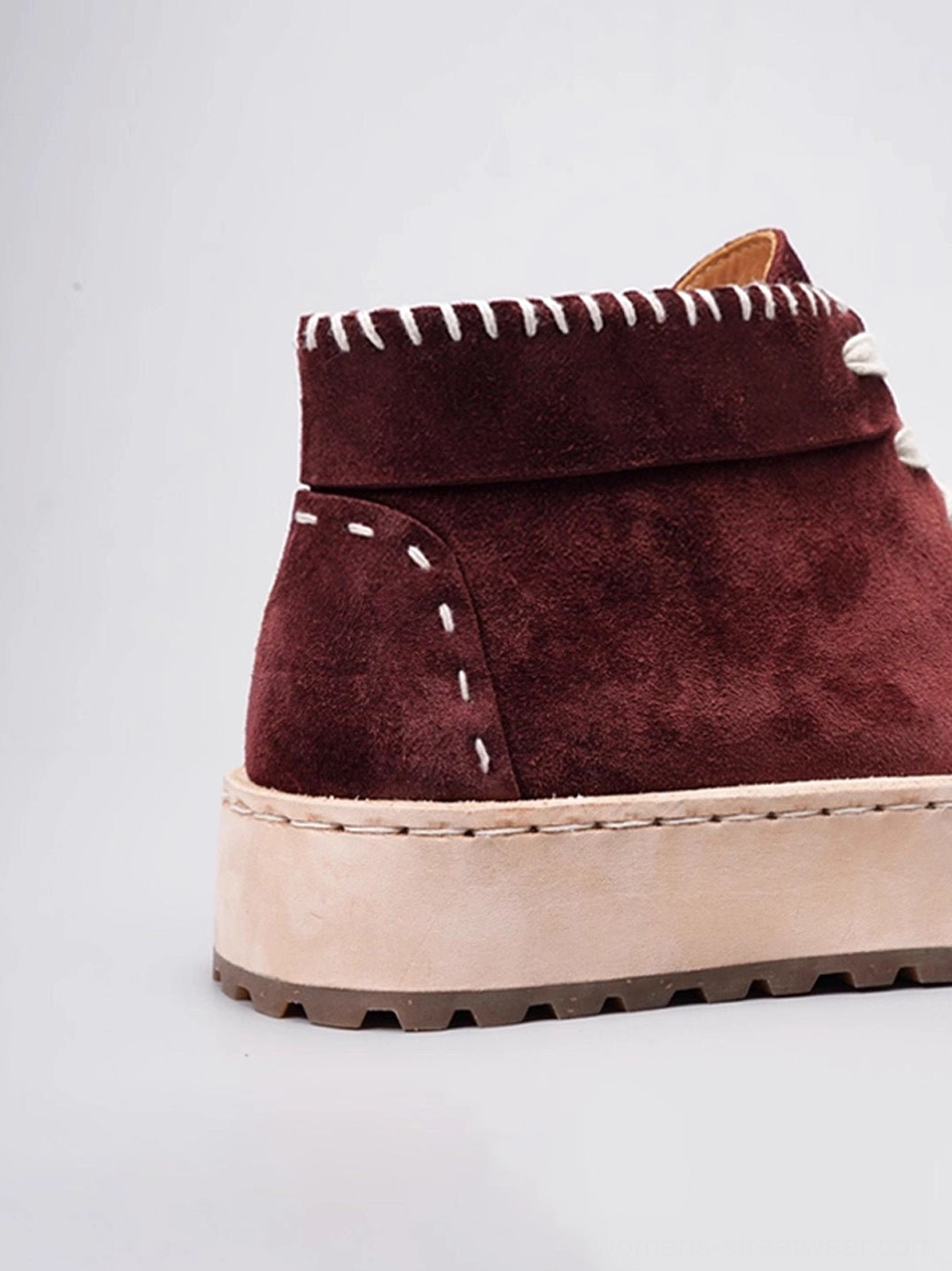 Low-profile split-toe leather chukka boots with ankle-high silhouette, contrast laces, and stacked platform sole
