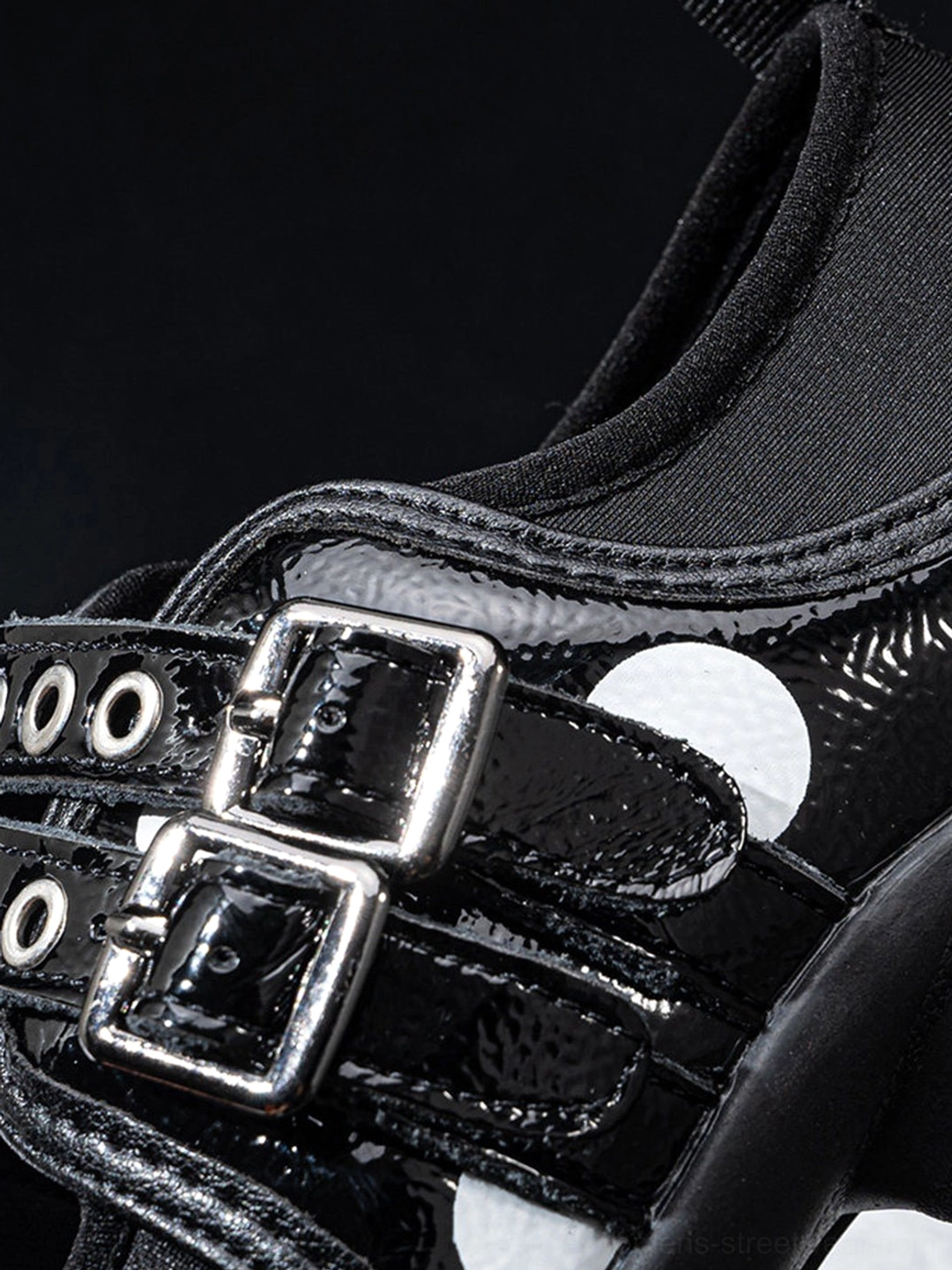 Low-profile strapped Mary Jane sneakers with split-toe design and monochrome polka dot panels