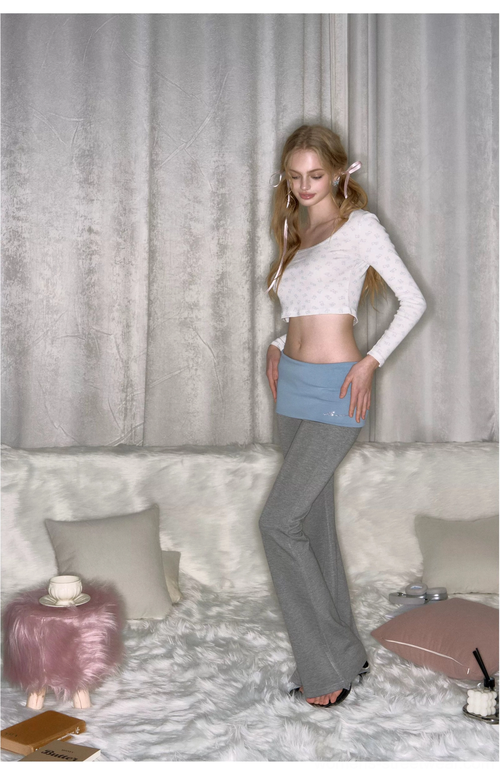 Gray colorblock fold-over micro flare yoga pants shown from a three-quarter side front angle