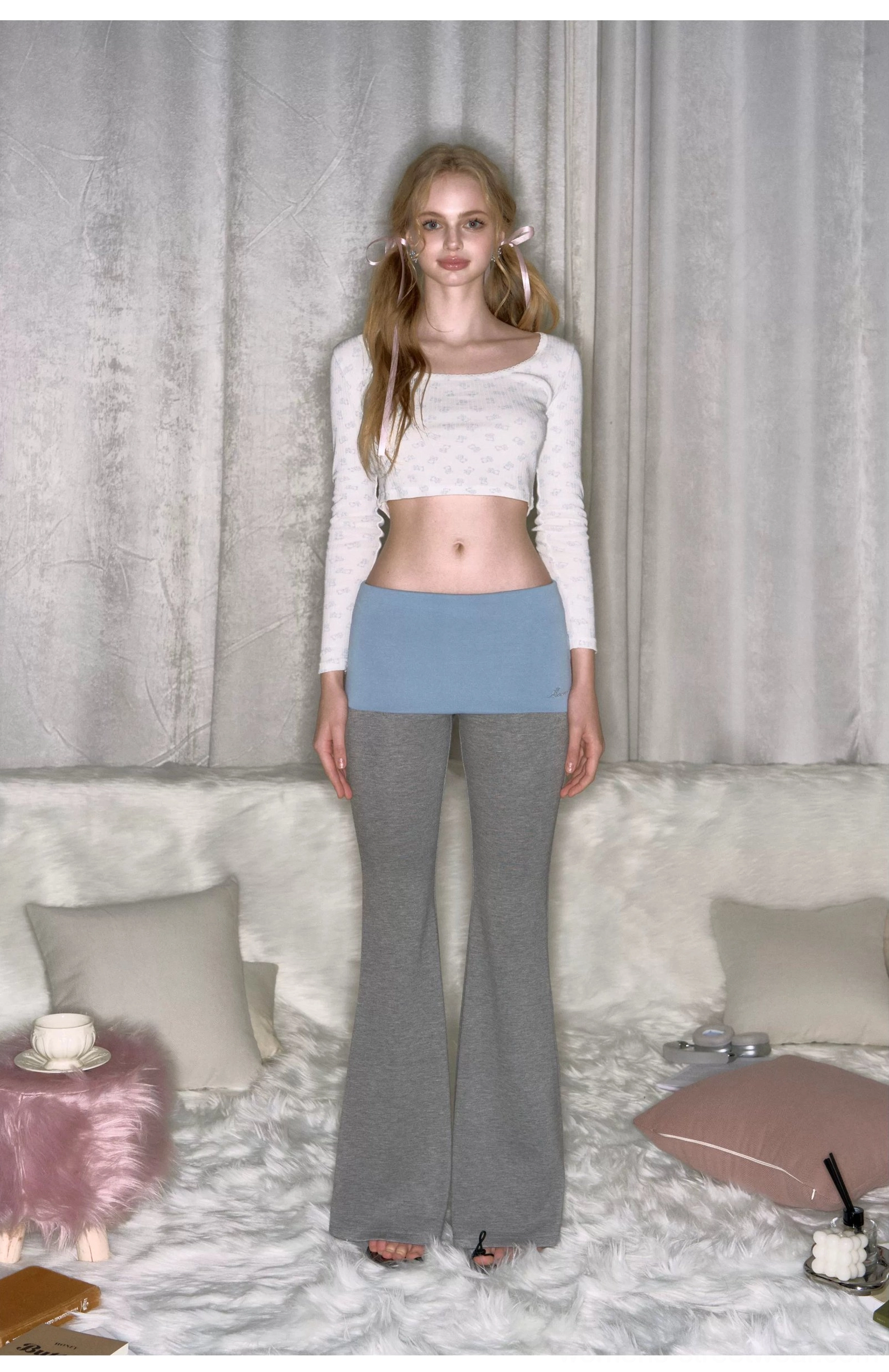 Straight front view of gray low-rise slim fit micro flare yoga pants with light blue contrast waistband