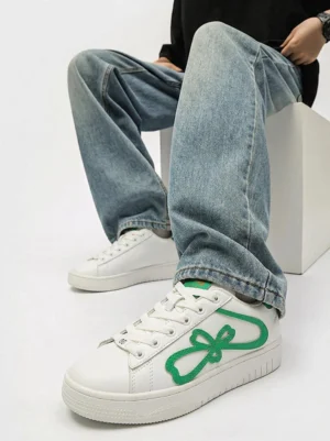 Lucky clover chunky platform sneakers worn with baggy blue jeans in a Korean Y2K streetwear outfit