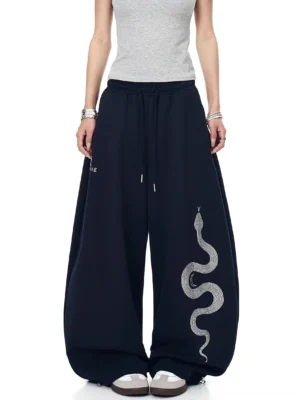 Navy Blue Lunar Serpent oversized fleece sweatpants with silver serpent graphic, elastic drawstring waist, and relaxed Korean streetwear fit