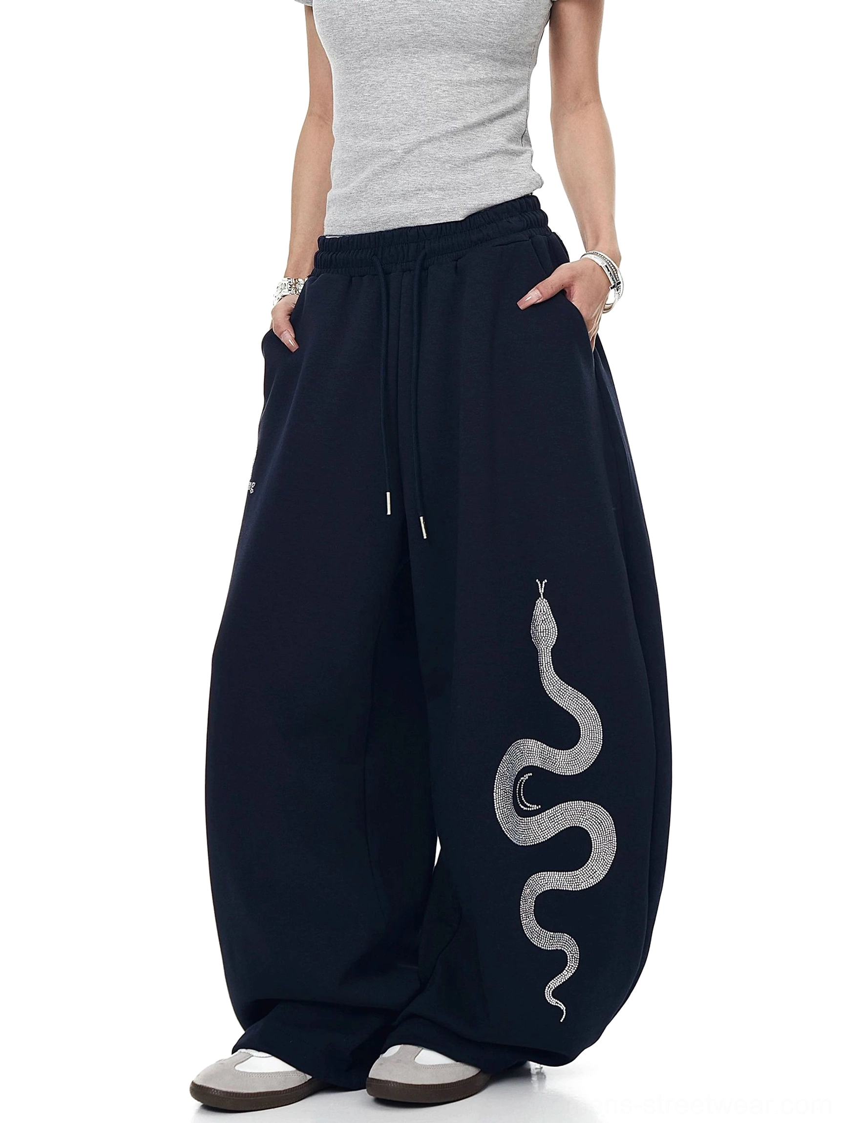 Navy Blue oversized Lunar Serpent sweatpants with functional side pockets, serpent thigh motif, wide legs, and drawstring elastic waist