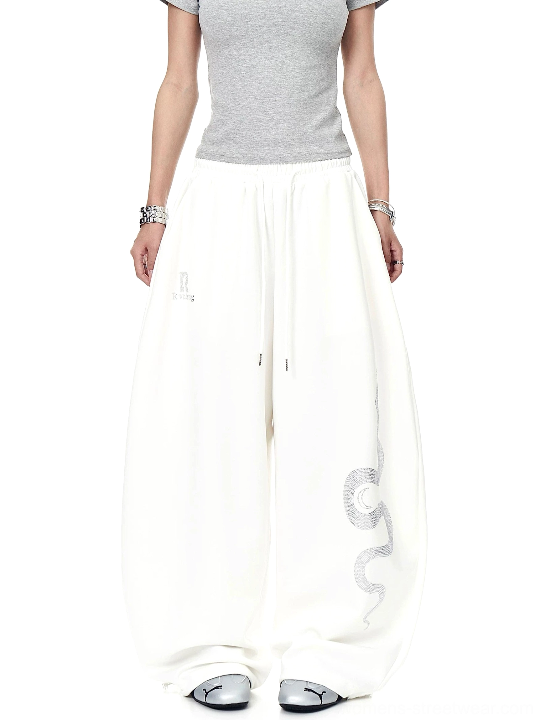 Solid off-white oversized wide-leg fleece sweatpants with relaxed drawstring waistband and minimalist contemporary streetwear styling