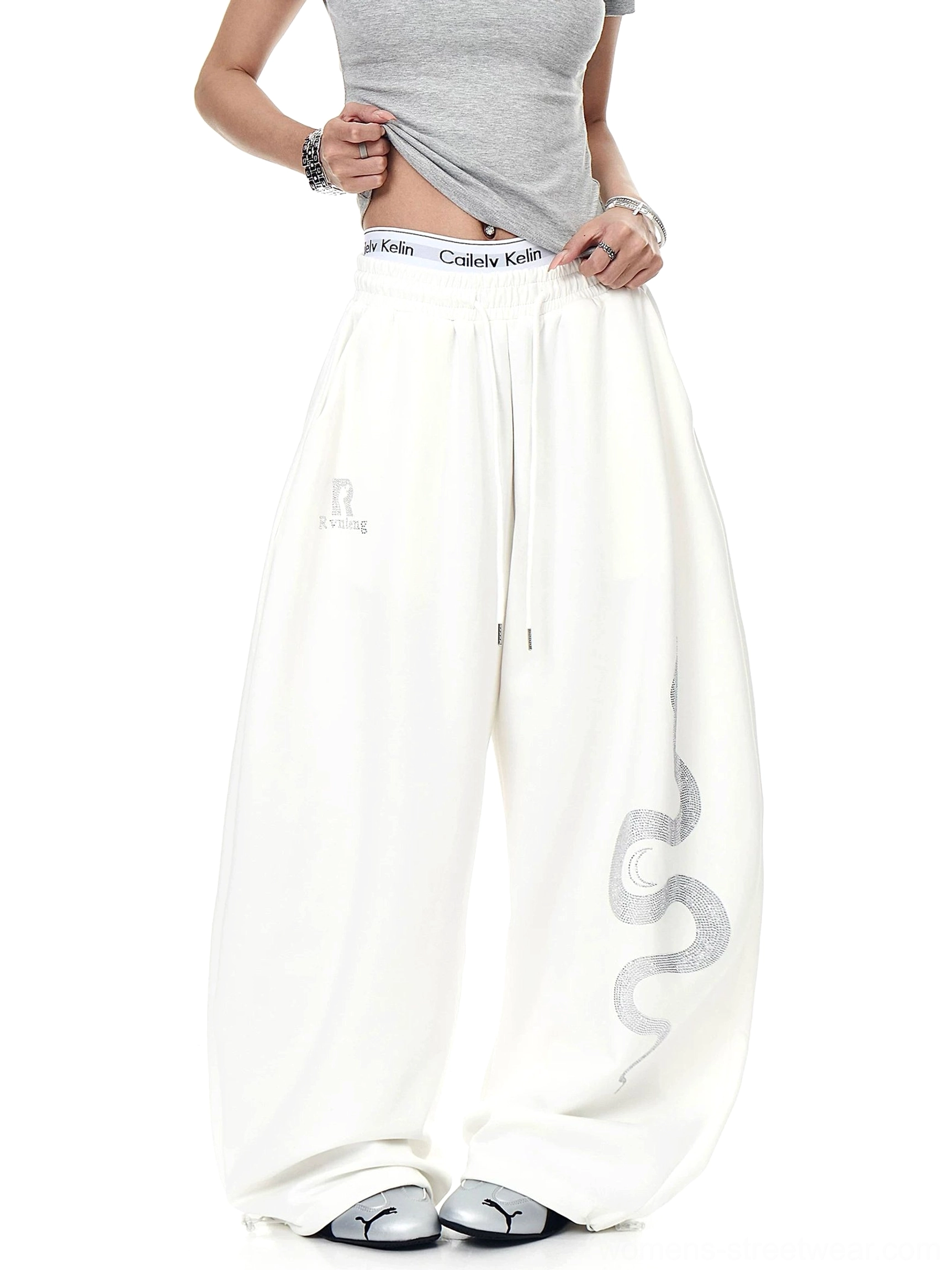 Off-white Lunar Serpent wide-leg sweatpants with statement serpent print, relaxed elastic waistband, and oversized Korean street style fit