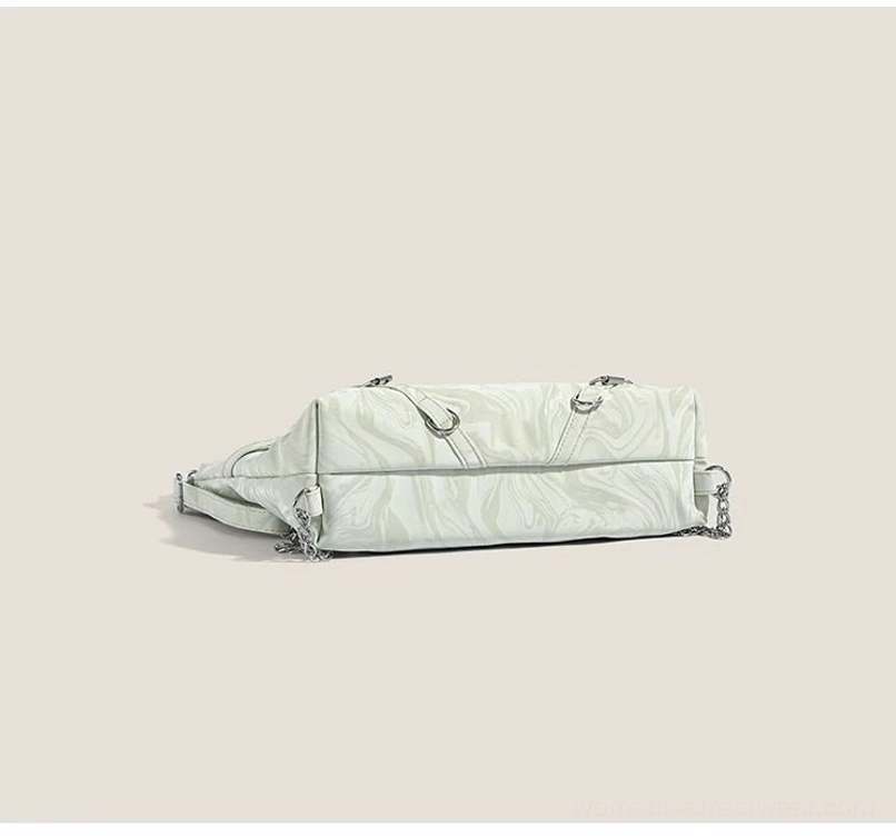 Bottom view of mint green butterfly chain hobo shoulder bag with side buckles and silver hardware