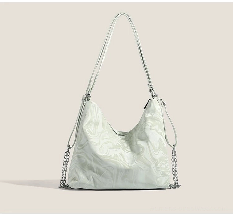 Mint green Y2K hobo shoulder bag flat front view with metal butterfly emblem and silver chain accents