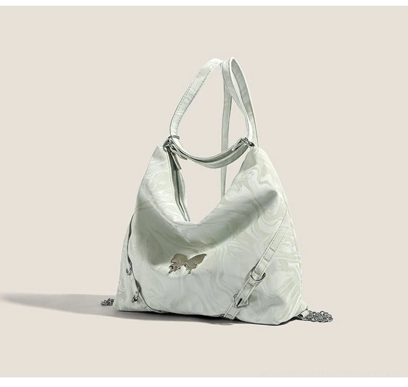 Mint green butterfly chain hobo shoulder bag side view showing glossy marbled surface and strap construction