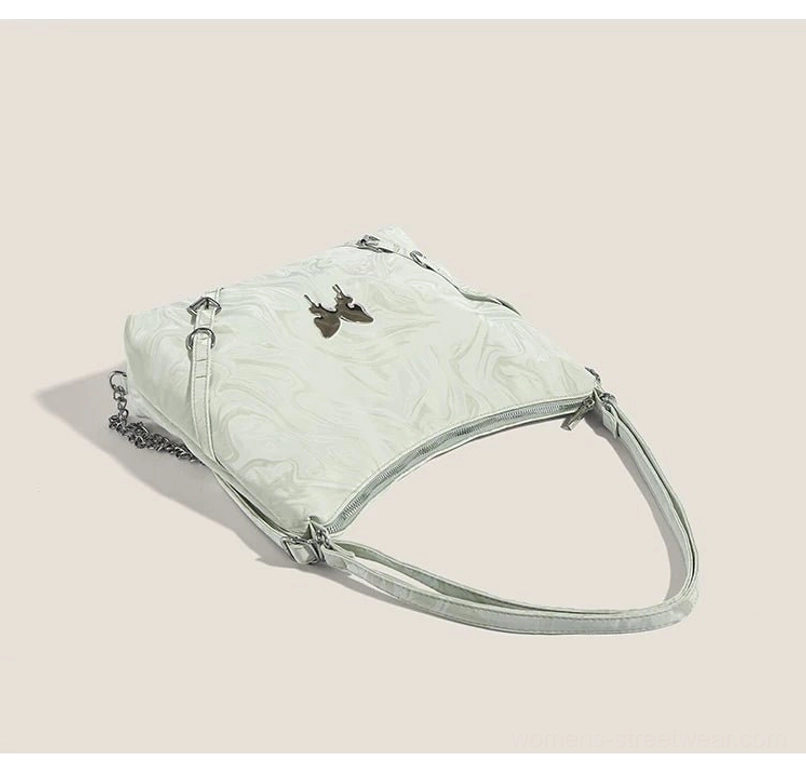 Top view of mint green marbled butterfly chain hobo bag showing handle straps and metal butterfly detail