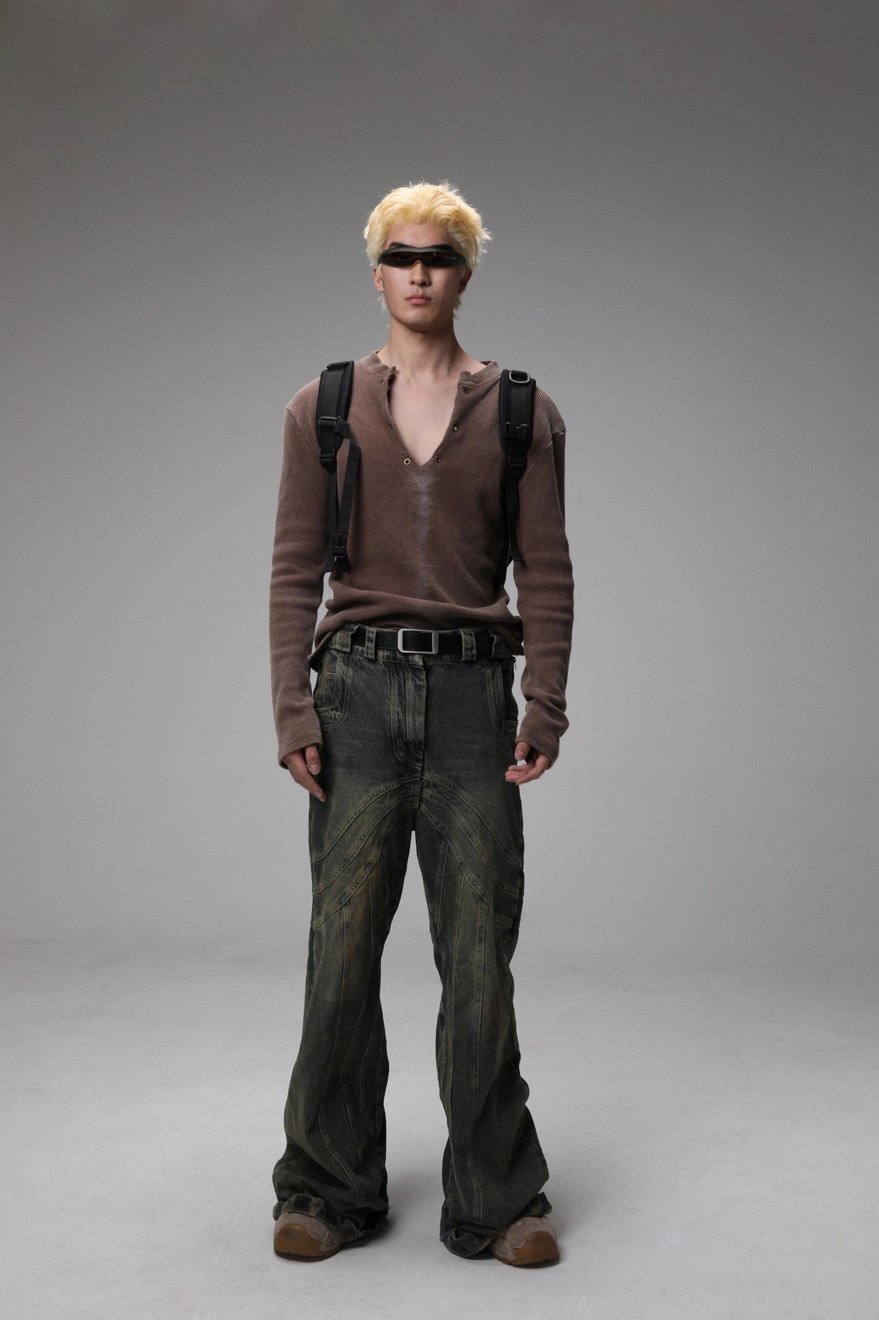 Maroon distressed Henley V-neck knit sweater front view in a modern Seoul streetwear ensemble