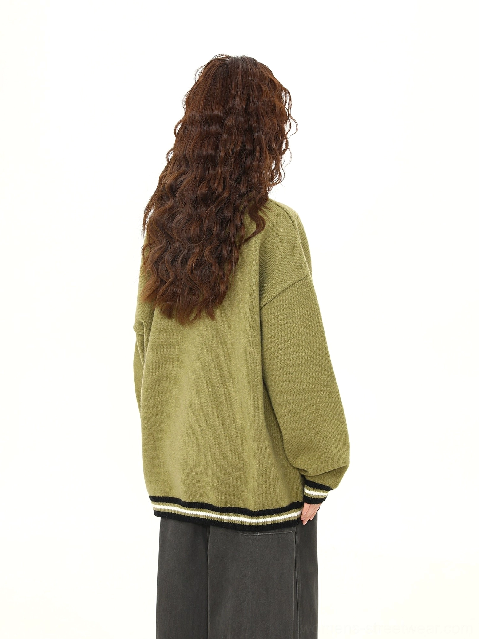 Back view of matcha green oversized knit streetwear sweater with solid color design and ribbed hem