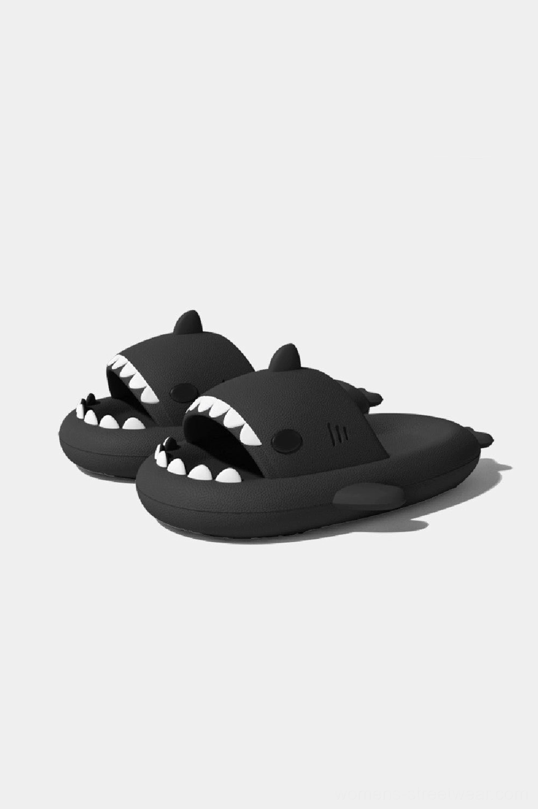 Matte black shark slide slippers with detailed teeth, shark fins, open-toe design, and minimalist casual styling