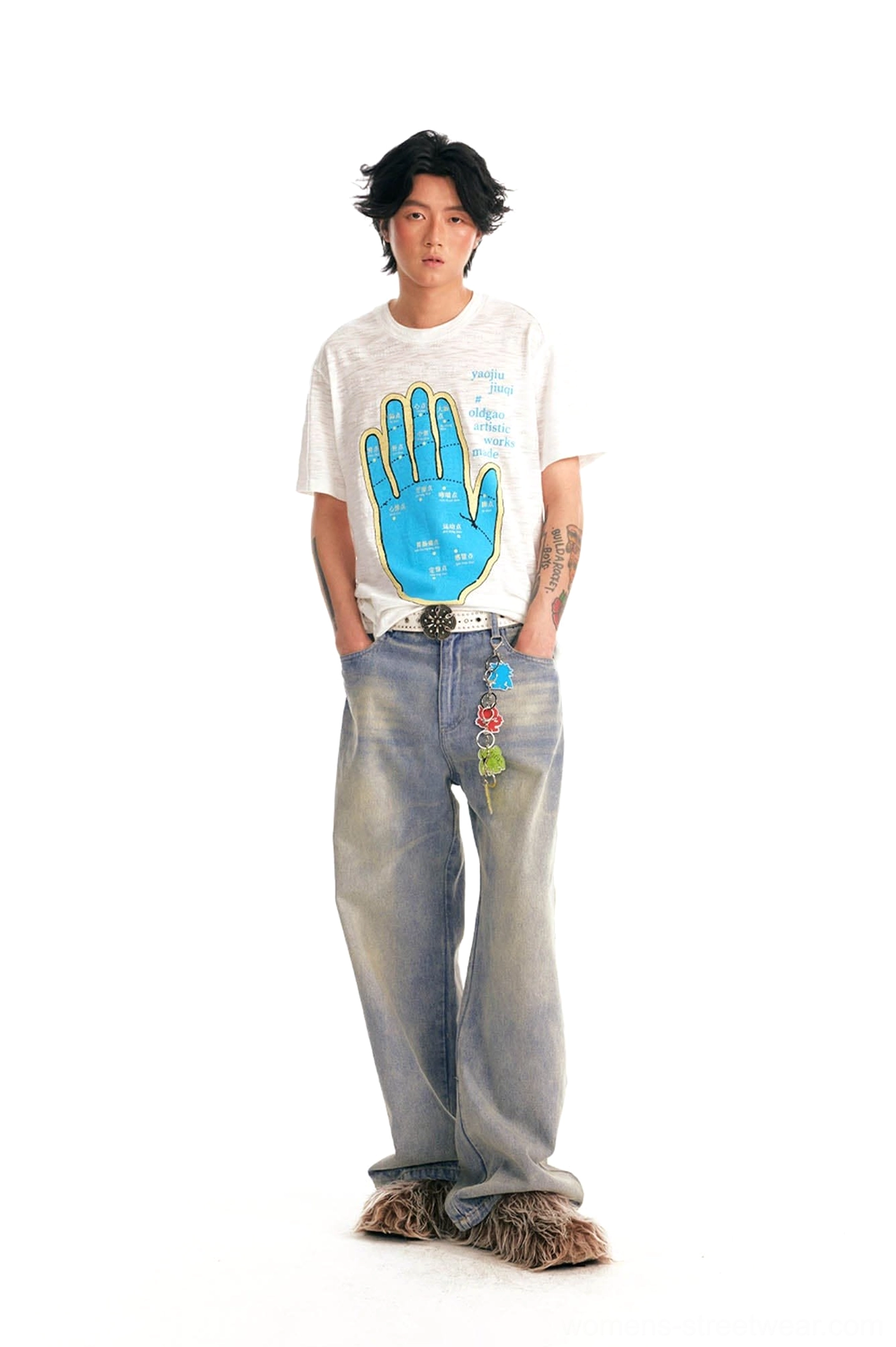Male model wearing meridian hand graphic cotton tee with washed wide-leg jeans in Korean inspired streetwear style