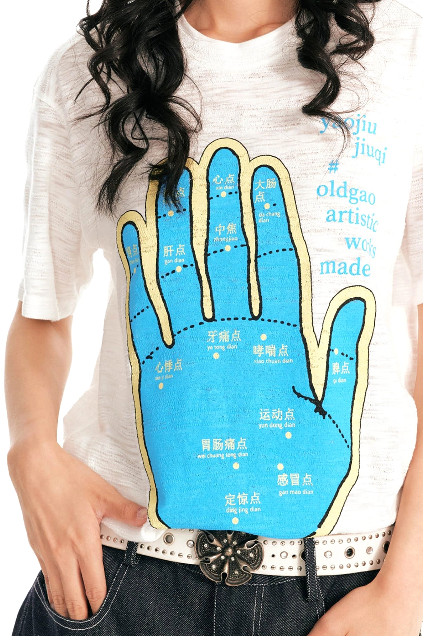 Close-up of blue palm meridian acupuncture print with Chinese and English text on textured white slub cotton tee