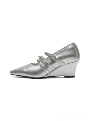 Silver and black double strap pointed toe wedge pumps with adjustable buckle closures and sleek low wedge heels