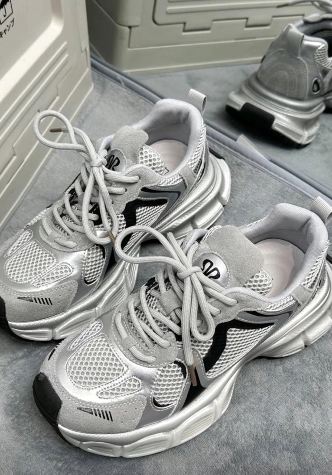 Metallic mesh chunky retro running sneakers pair flat lay showing layered mesh and suede-look upper panels
