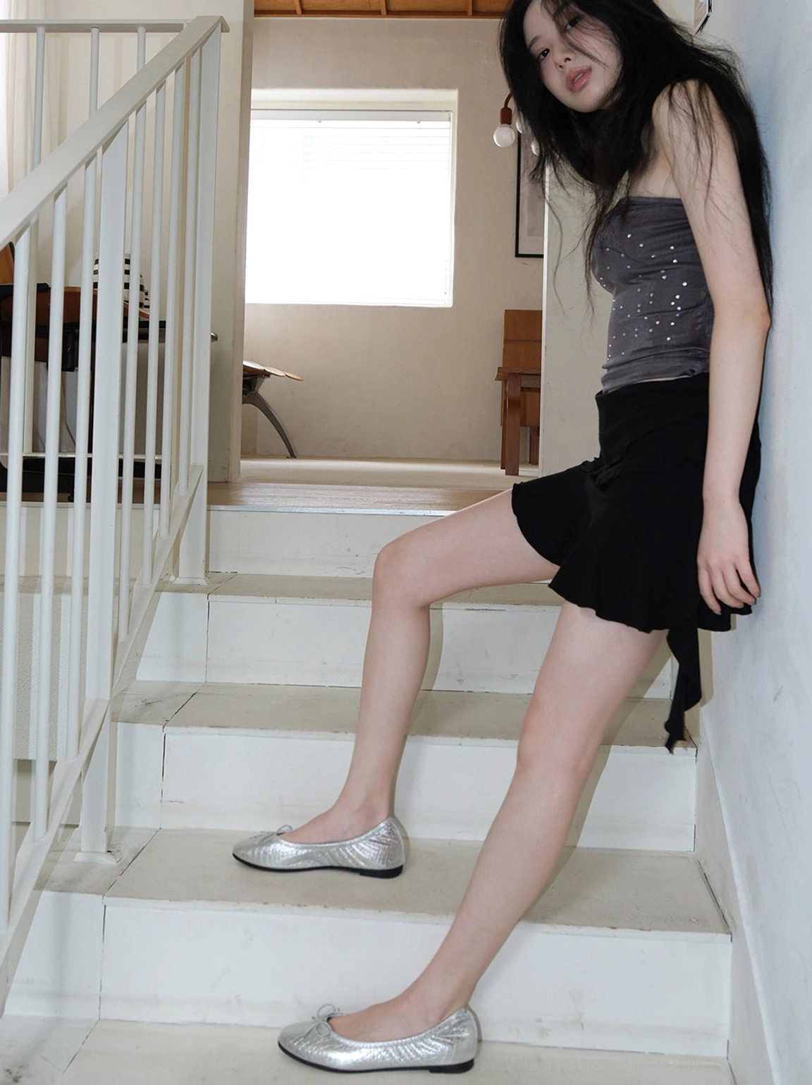 Metallic quilted ballet flats with bow details styled as a versatile everyday streetwear footwear choice