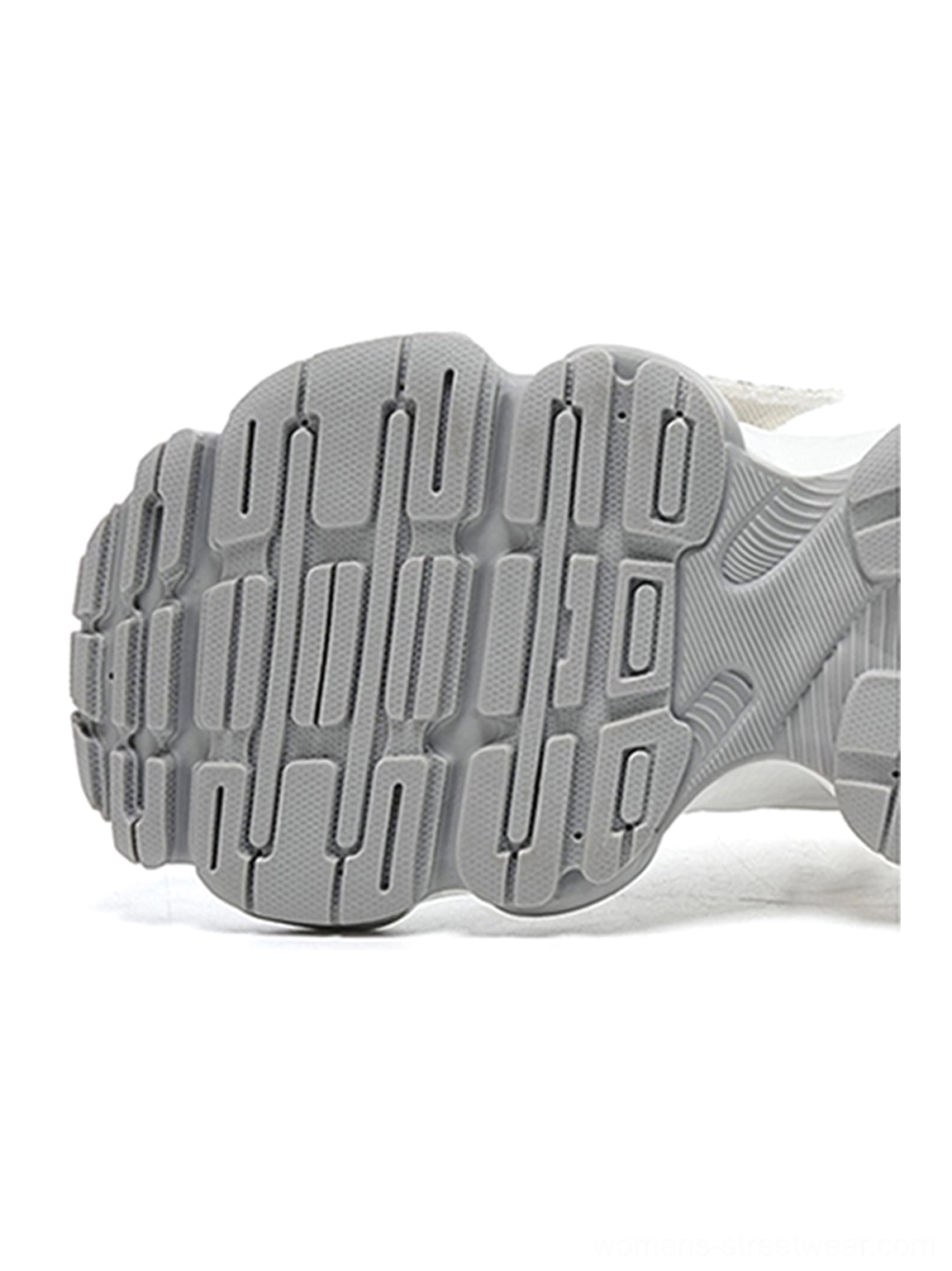 Metallic silver mesh tech runner sneakers with futuristic chunky streetwear profile, breathable layered upper, reflective silver panels, lace-up closure, and sculpted outsole