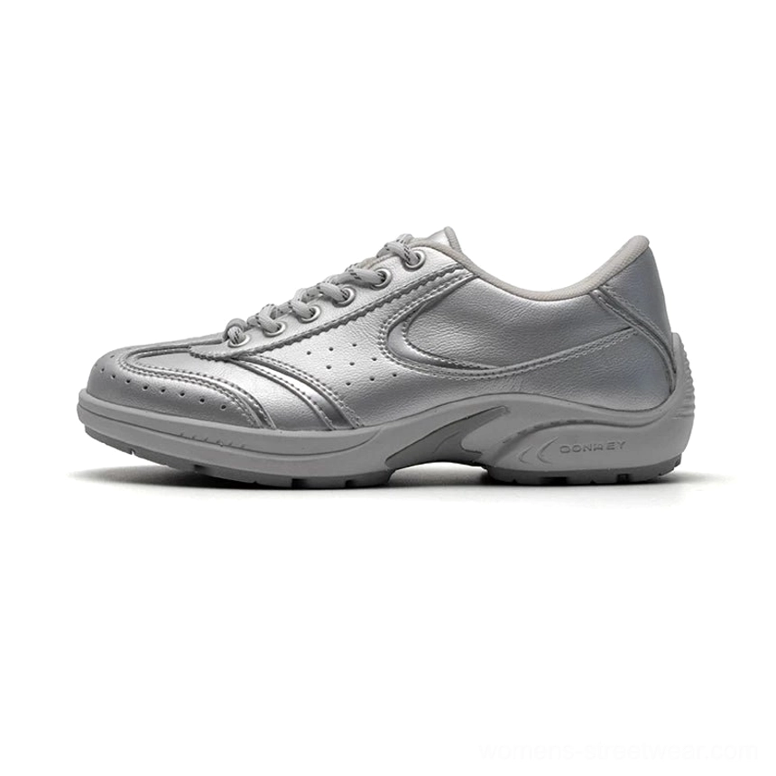 Metallic silver retro court sneakers with perforated leather panels breathable detailing and classic low top streetwear silhouette