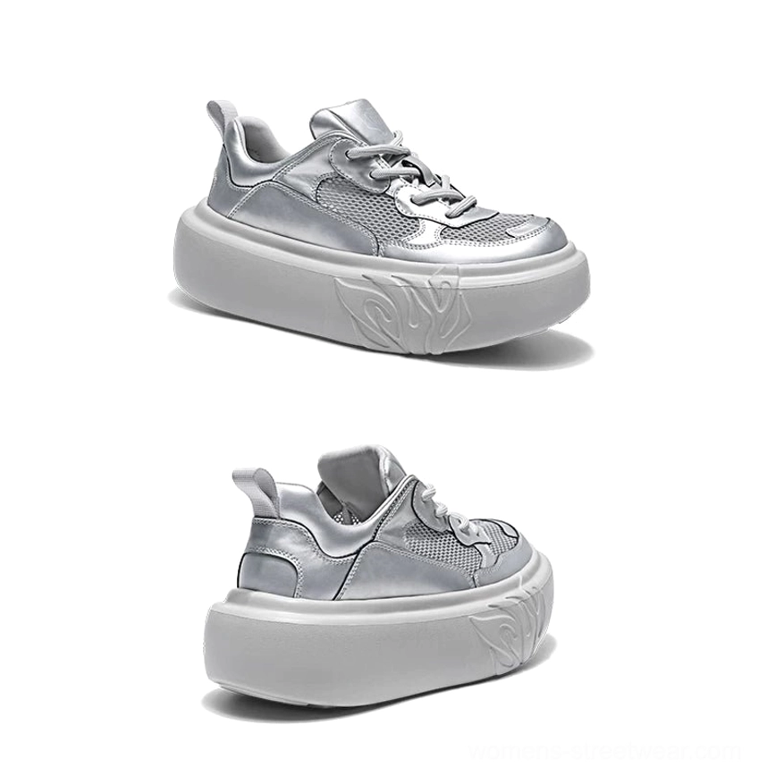 Left side view of a metallic silver platform sneaker with mesh and leather-look panels and bold flame embossed chunky outsole