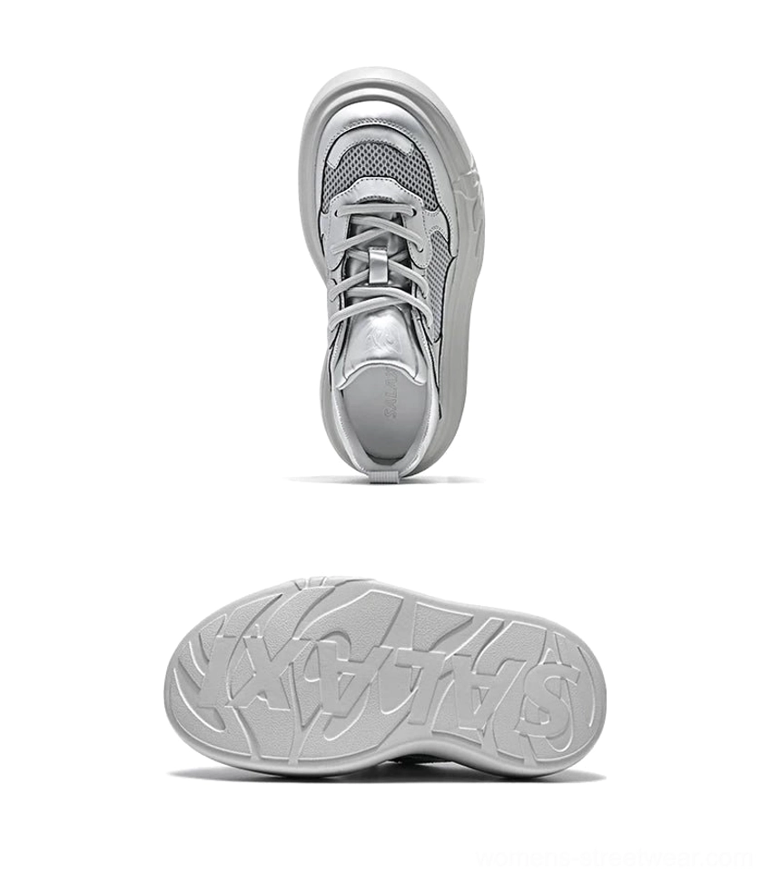 Top view of metallic silver platform sneaker showing lace-up system, breathable mesh toe box, and rounded chunky sole