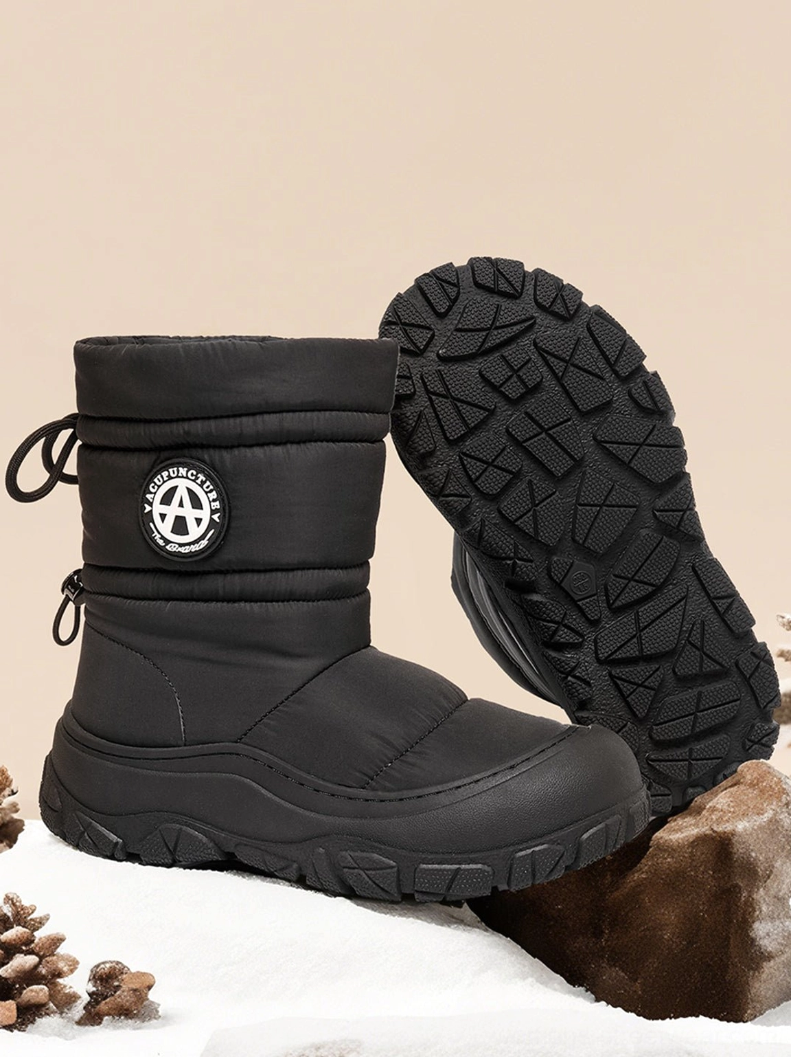 Metallic silver winter puffer boots with a cozy padded shaft and bold molded outsole for streetwear outfits