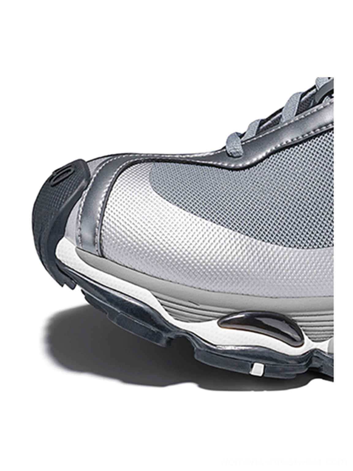 Metallic split-toe technical runner sneaker with silver synthetic overlays, breathable mesh panels, and modern techwear styling