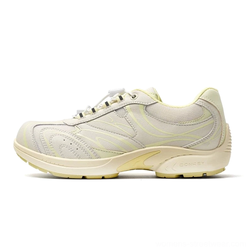 Cream yellow and off white streamline trail sneakers with retro jogging shoe silhouette and cushioned sole