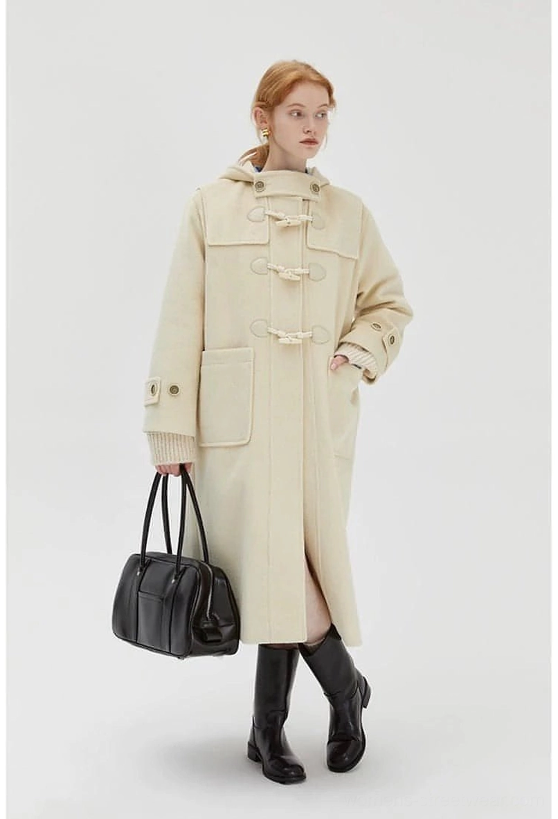 Mid-length hooded duffle coat worn model standing pose showcasing silhouette and proportions