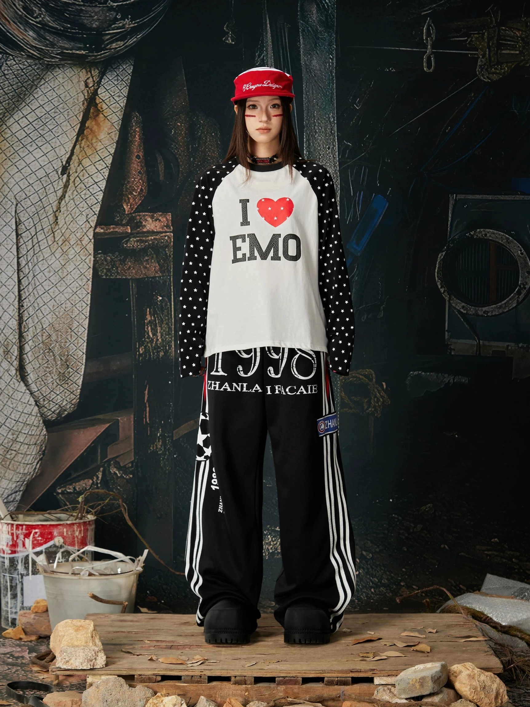 Black 1998 graphic wide-leg streetwear sweatpants with oversized silhouette, contrast side stripes, and relaxed urban styling